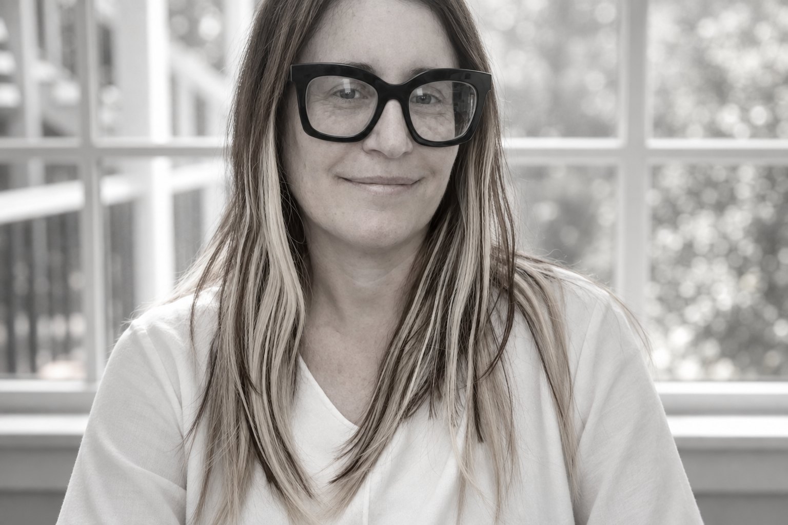 Keren Porat, Psy.D., by a window